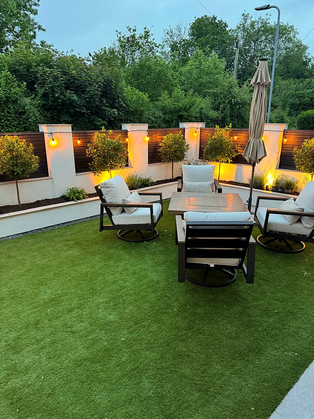 Garden feature lighting with festoon and uplighters, outdoor electrical installation in South Wales by Livvingale